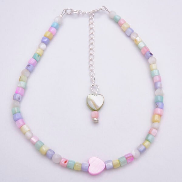 Mother of Pearl Anklet with Sterling Silver clasp and extender chain Mother of Pearl Anklet with Sterling Silver spring ring clasp and extender chain shown from above on plain white background
