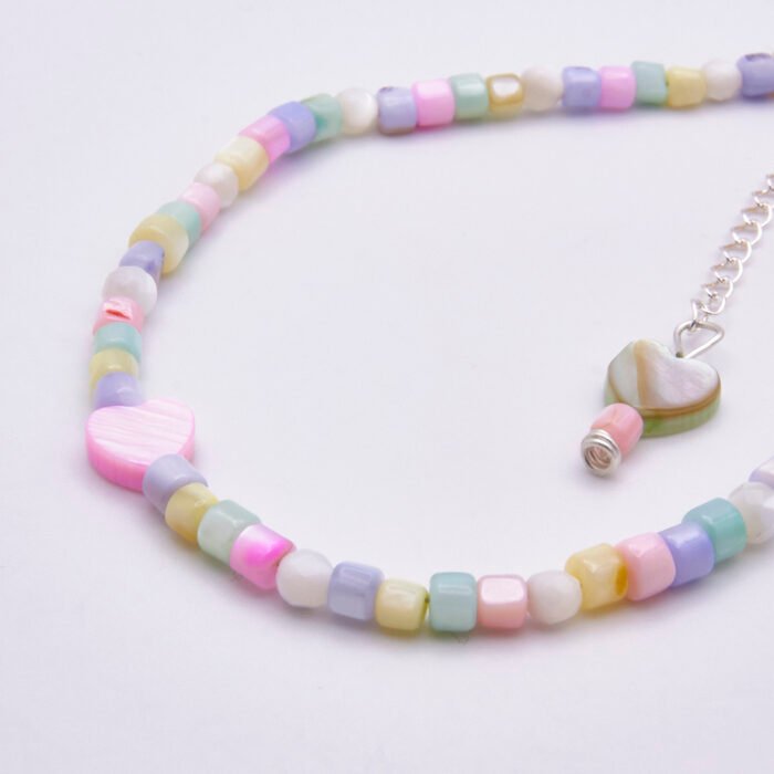 Mother of Pearl Heart Anklet Mother of Pearl Heart Anklet close up of beads and hearts on plain white surface