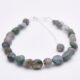 Moss Agate and Labradorite Bracelet, 2nd bracelet shown on flat white surface