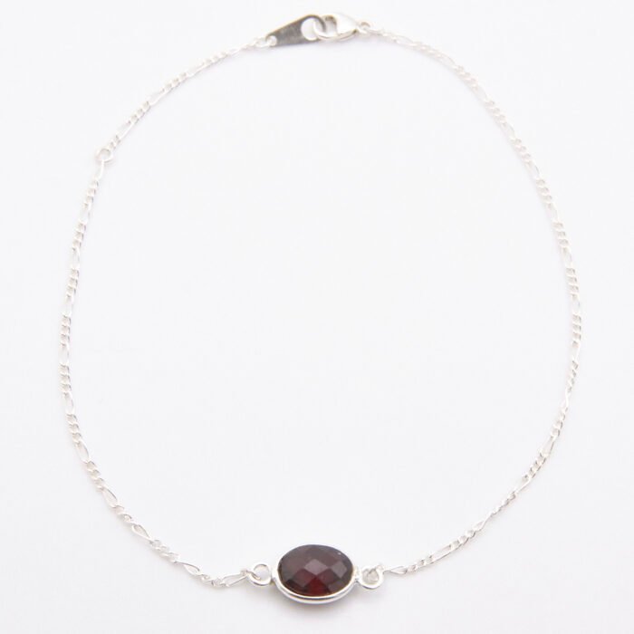 Sterling Silver Bezel-set Garnet Bracelet shown from above on flat white surface