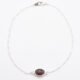 Sterling Silver Bezel-set Garnet Bracelet shown from above on flat white surface
