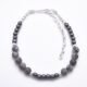 Grey Banded Agate and Hematite Sterling Silver Bracelet viewed from above on flat white surface