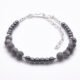 Grey Banded Agate and Hematite Sterling Silver Bracelet shown on flat white surface