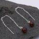 Garnet and Sterling Silver Threader Earrings 1 Garnet and Sterling Silver Threader Earrings on rock