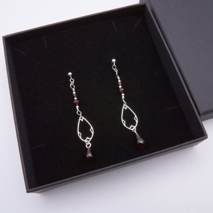 Garnet and Sterling Silver Deco Style Dangle Earrings Garnet and Sterling Silver Deco Style Dangle Earrings shown in box