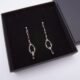 Garnet and Sterling Silver Deco Style Dangle Earrings Garnet and Sterling Silver Deco Style Dangle Earrings shown in box