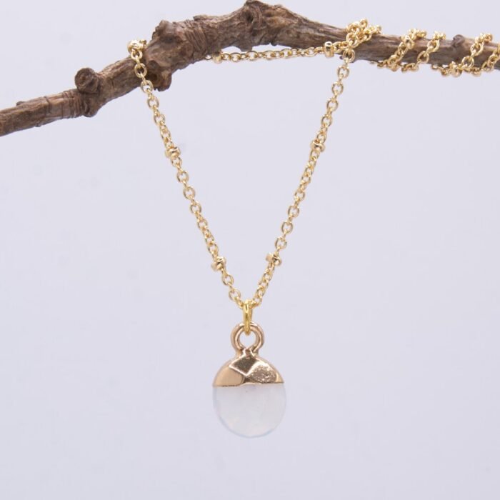 Opalite Gold Plated Necklace hanging from twig