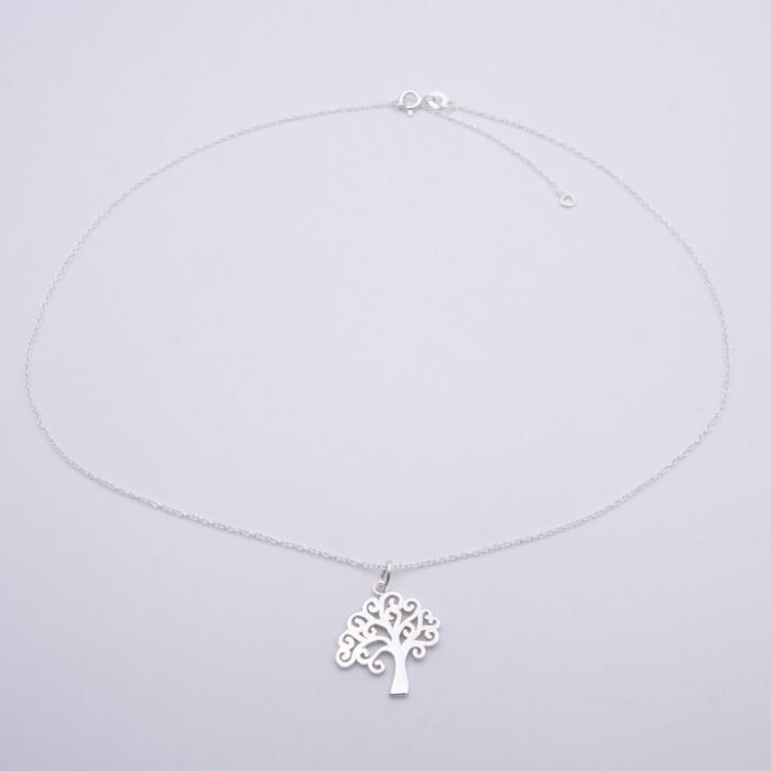 Tree Charm Sterling Silver Necklace on plain white surface