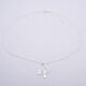 Tree Charm Sterling Silver Necklace on plain white surface