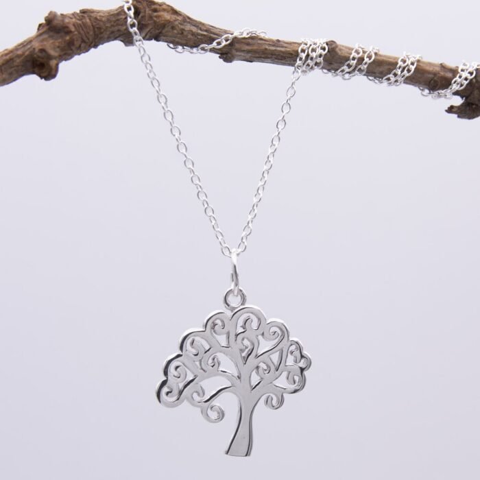 Tree Charm Sterling Silver Necklace hanging from twig