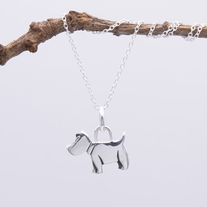 Dog Charm Sterling Silver Necklace shown close up hanging from twig