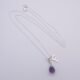 Amethyst Teardrop Pendant Necklace with additional Initial Charm shown on flat white surface