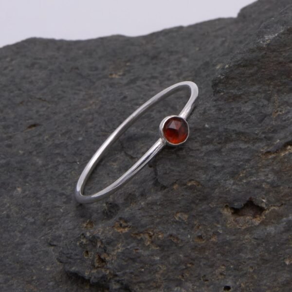 Garnet Sterling Silver Slimline Ring on rock