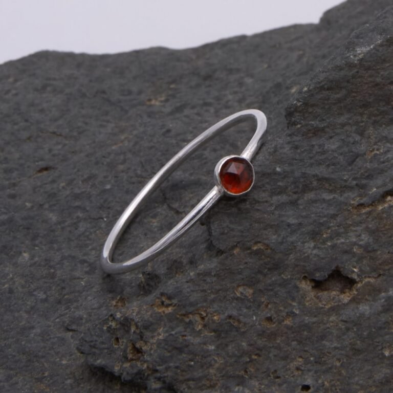 Garnet Sterling Silver Slimline Ring 1 Garnet Sterling Silver Slimline Ring on rock