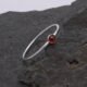 Garnet Sterling Silver Slimline Ring 1 Garnet Sterling Silver Slimline Ring on rock