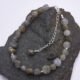 Labradorite Smooth Chip Bead Sterling Silver Bracelet with extender chain with wire-wrapped bead decoration shown on dark grey stone