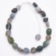 Moss Agate and Labradorite Bracelet with Sterling Silver clasp and extender chain with bead trim, shown from above on plain white surface