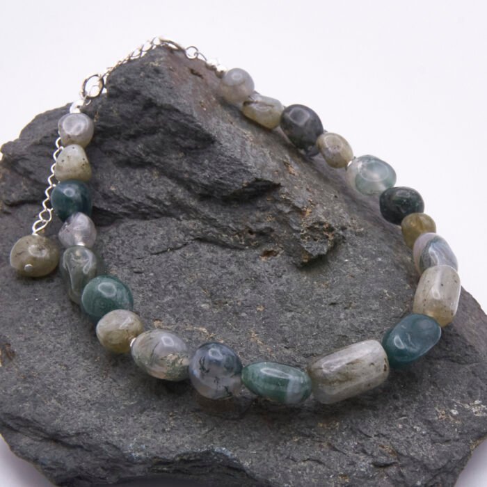 Moss Agate and Labradorite Sterling Silver Bracelet shown on dark grey stone