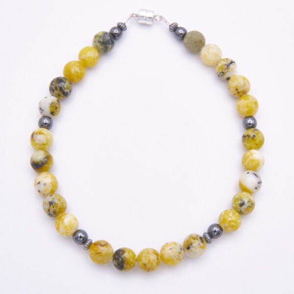 Yellow Turquoise and Hematite Sterling Silver Bracelet with Magnetic Clasp shown on flat surface viewed from above