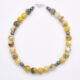 Yellow Turquoise and Hematite Sterling Silver Bracelet with Magnetic Clasp shown on flat surface viewed from above