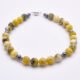 Yellow Turquoise and Hematite Sterling Silver Bracelet with Magnetic Clasp angled view on flat surface