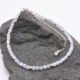 Blue Lace Agate and Sterling Silver Bracelet with extender chain with wire-wrapped bead decoration shown laid flat on a dark grey stone
