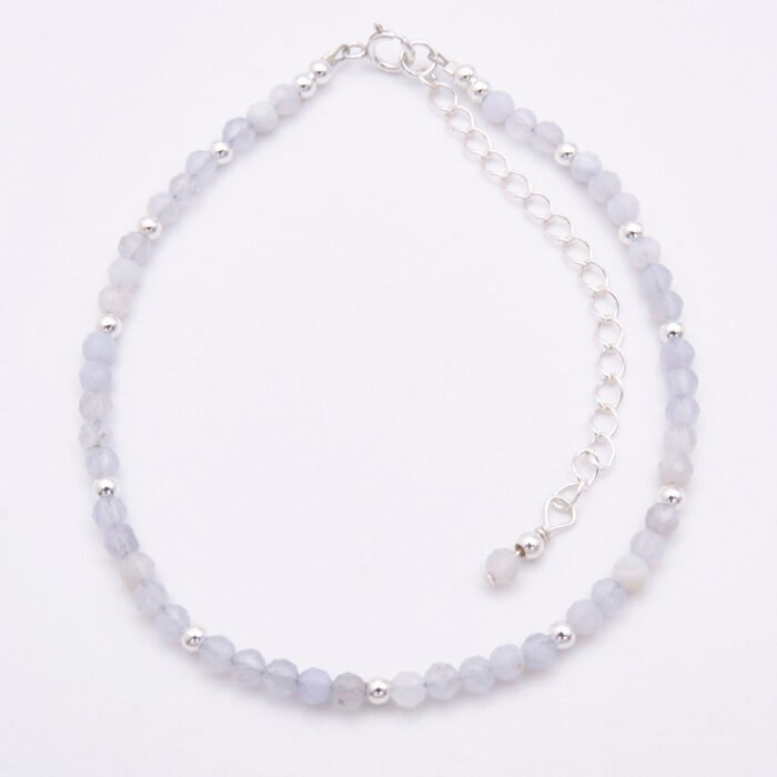 Blue Lace Agate and Sterling Silver Bracelet top down view on plain white surface