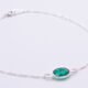 Sterling Silver Bezel-Set Green Onyx Bracelet close up of Green Onyx on flat white surface