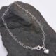 Sterling Silver Heart Link Chain Bracelet with Puffy Heart Charm on dark grey rock Sterling Silver Heart Link Chain Bracelet with Puffy Heart Charm on dark grey rock