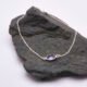 Sterling Silver Bezel-set Amethyst Bracelet shown on grey stone