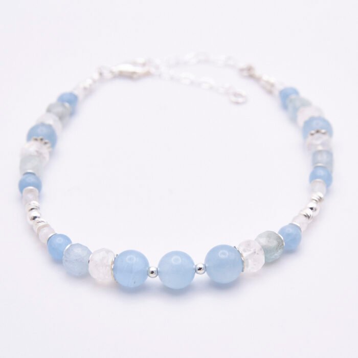 Aquamarine and Rainbow Moonstone Sterling Silver bracelet shown on flat white background