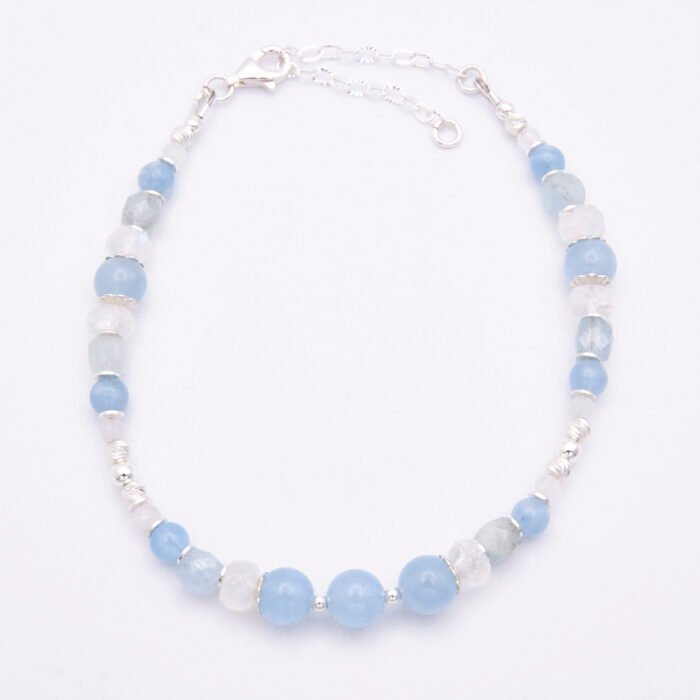 Aquamarine and Rainbow Moonstone Sterling Silver Bracelet top down view on white background