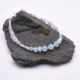 Aquamarine and Rainbow Moonstone Sterling Silver Bracelet shown on dark grey stone