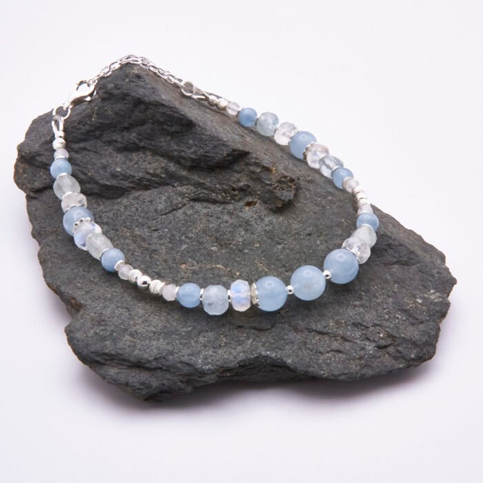 Aquamarine and Rainbow Moonstone Sterling Silver Bracelet on grey stone