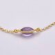 Amethyst 24k Gold Plated Sterling Silver Bracelet on flat white surface showing side on close up of bezel-set amethyst