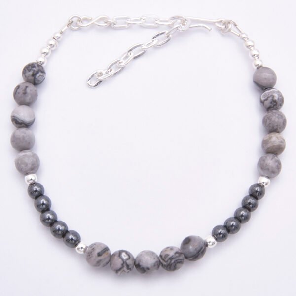 Grey Banded Agate and Hematite Sterling Silver Bracelet with extender chain shown from above on plain white surface
