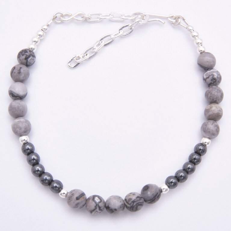 Grey Banded Agate and Hematite Sterling Silver Bracelet with extender chain shown from above on plain white surface