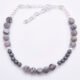 Grey Banded Agate and Hematite Sterling Silver Bracelet with extender chain shown from above on plain white surface
