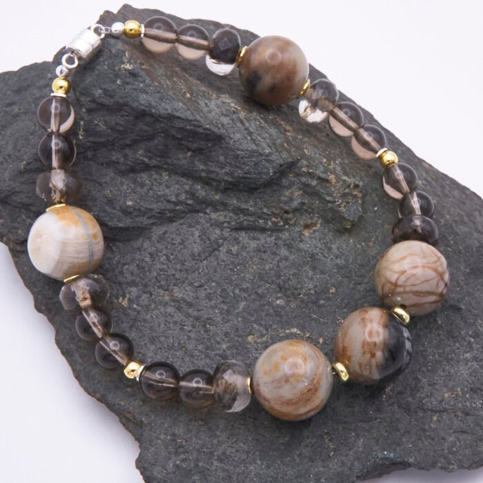 Picasso Jasper, Smoky Quartz and Watermelon Quartz Bracelet on dark grey stone