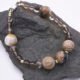 Picasso Jasper, Smoky Quartz and Watermelon Quartz Bracelet on dark grey stone