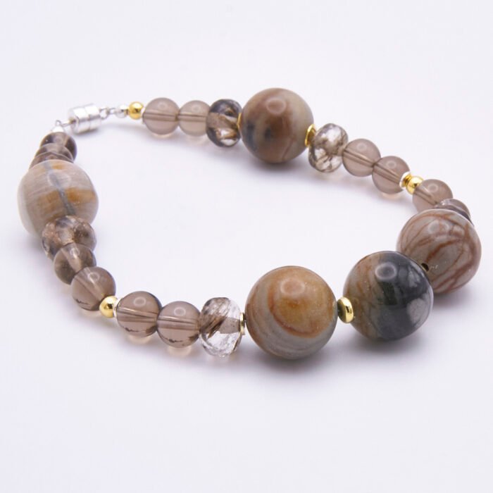 Picasso Jasper, Smoky Quartz and Watermelon Quartz Bracelet side view on white surface