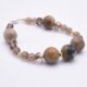 Picasso Jasper, Smoky Quartz and Watermelon Quartz Bracelet side view on white surface