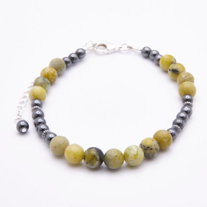 Yellow Turquoise and Hematite Bracelet with Lobster Clasp and Extender Chain on flat white surface