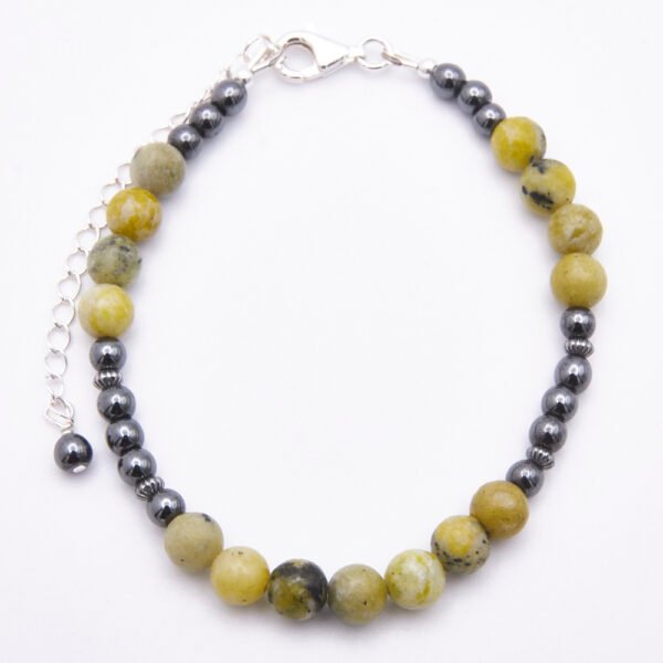 Yellow Turquoise and Hematite Bracelet with Lobster Clasp and Extender Chain with Hematite bead decoration shown from above on flat white surface