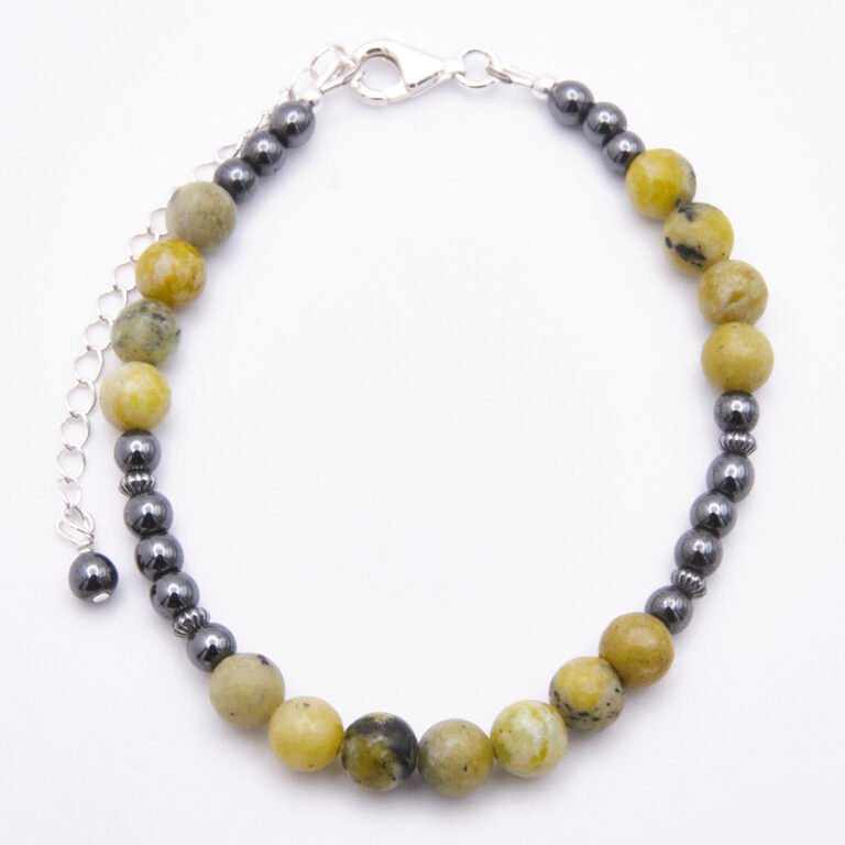 Yellow Turquoise and Hematite Bracelet with Lobster Clasp and Extender Chain with Hematite bead decoration shown from above on flat white surface