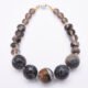 Picasso Jasper, Smoky Quartz and Smoky Watermelon Quartz Mixed Metals Bracelet with magnetic clasp top down on plain white surface