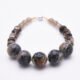 Picasso Jasper, Smoky Quartz and Smoky Watermelon Quartz Mixed Metals Bracelet with magnetic clasp shown with focus on Picasso Jasper beads on flat white surface