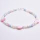 Mother of Pearl Heart Trio Bracelet shown on flat white surface with side-on view