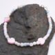 Mother of Pearl Heart Trio Bracelet shown on dark grey stone