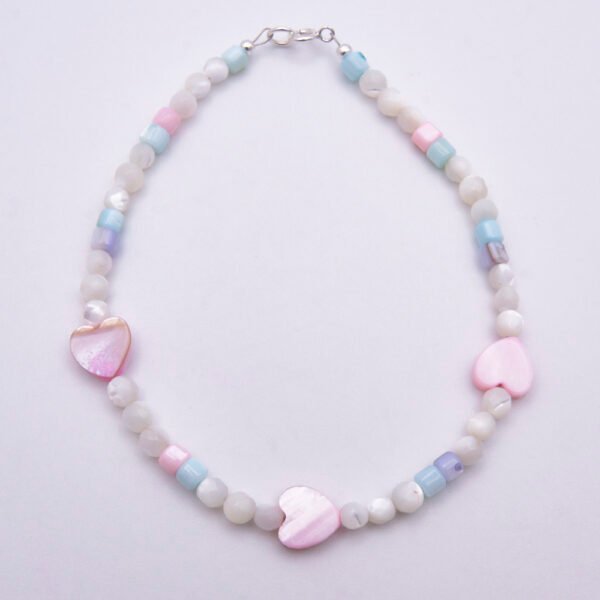 Mother of Pearl Heart Trio Bracelet shown from above on plain white background
